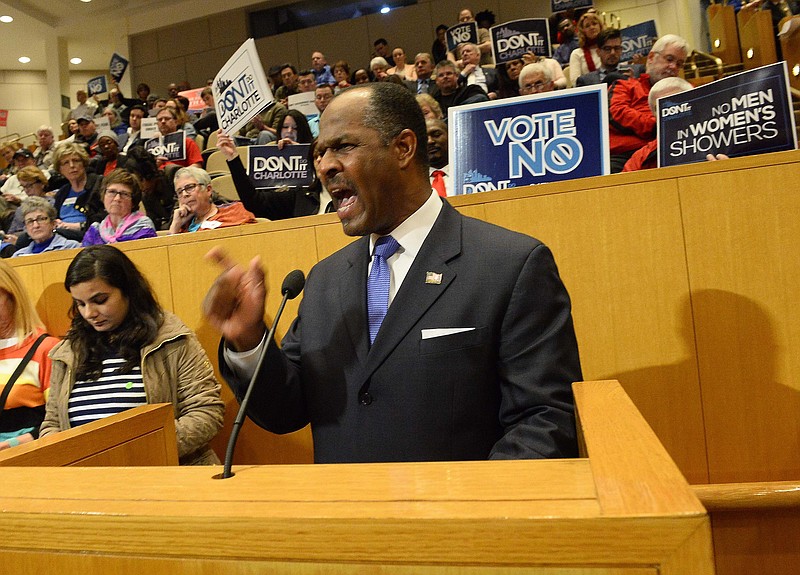 In this photo taken on Monday, Feb. 22, 2016, Leon Threatt of Charlotte, N.C., speaks against the nondiscrimination ordinance during a City Council vote on the nondiscrimination ordinance, in Charlotte.