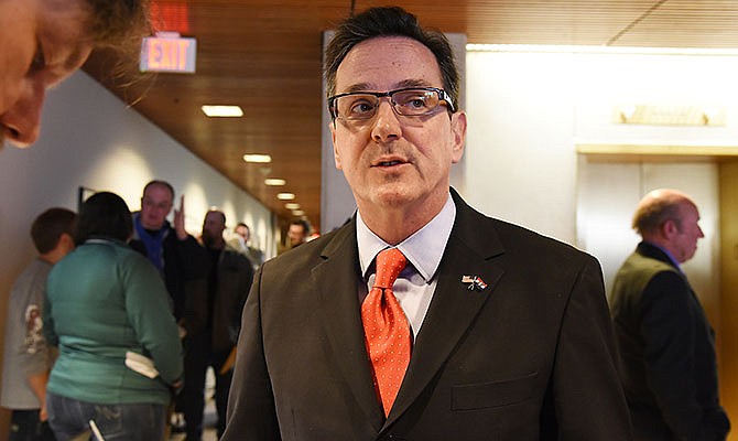 Sen. Kurt Schaefer, R-Columbia, is asked questions about University of Missouri funding Tuesday while he waits in line to file to run as an incumbent to the Missouri Senate.