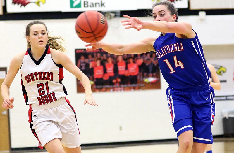 Elizabeth Lutz of California passes the ball in front of Meagan Barnett of Southern Boone during Wednesday night's Class 3 District 8 semifinal game at Ashland.