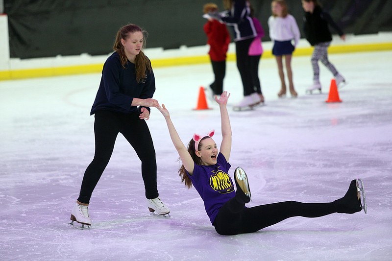 Skylar Gaw, left, 13, and Makenna Johnson, 13, rehearse ice dancing Tuesday at Washington Park Ice Arena. The dance is part of the 54th Annual Ice Park Show, titled "Off the Pages."