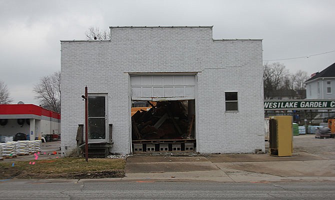 The structure on East Second Street known as the Coca-Cola Building was being demolished Tuesday, March 1, 2016, to make space for a new garden center at Westlake Ace Hardware.