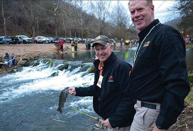 In this March 1, 2016 photo, Gov. Jay Nixon (left) and State Parks director Bill Bryan pose with a trout Nixon caught at Roaring River State Park during the 2016 Missouri Trout Opener.