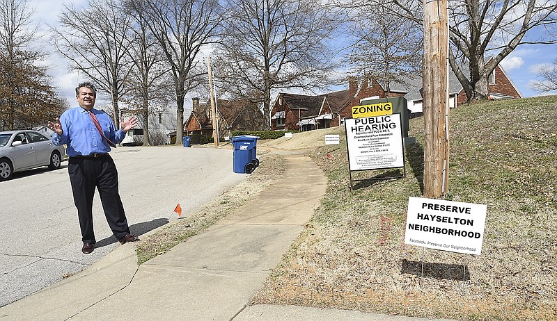 Concerned Hayselton Drive resident Joe Bednar shows how far the edge of a driveway could go as he and other neighborhood residents spoke to a reporter Tuesday regarding the proposed River Bluff Condominium development. They have safety concerns about increased traffic, traffic speed and a number of other issues regarding the proposed development.