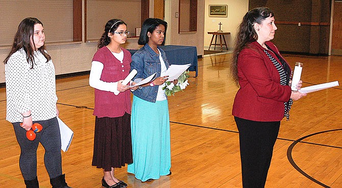 Several of the participants in the 2016 World Day of Prayer at the California United Church of Christ on Friday, March 4, prepare to move forward to take their places in the service. They are, from left, Grace Dampf, Eva Muenks, Lucy Muenks and Anastasia Muenks.