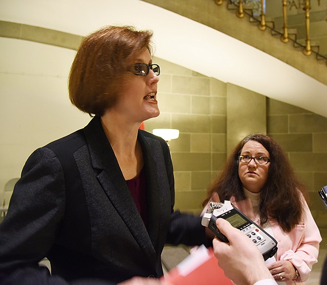 Amy Fite, left, and Monica Hackett, both members of the Keeping Missouri Kids Safe Coalition, address a reporter after Wednesday's rally in the Capitol Rotunda. 
