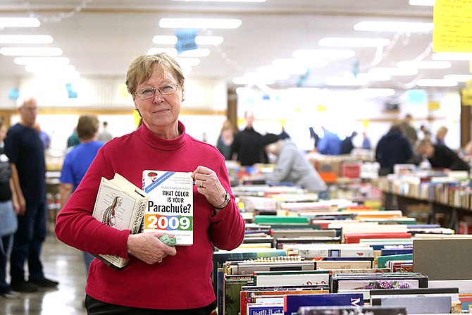 Carol Davidson poses for a portrait at the annual used book sale. Davidson, who has volunteered with the Adult Basic Literacy Education program 30 years, also volunteered at the sale, which she described as ABLE's "life blood."