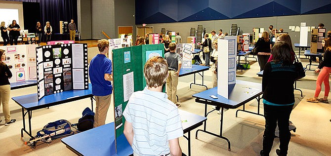 South Callaway High School students present their research during a science fair Wednesday night. The students conducted a variety of experiments and then shared their results with attendants. Projects included research on the health effects of soda, comparing biotin and prenatal vitamins and assessing health based on iridology.