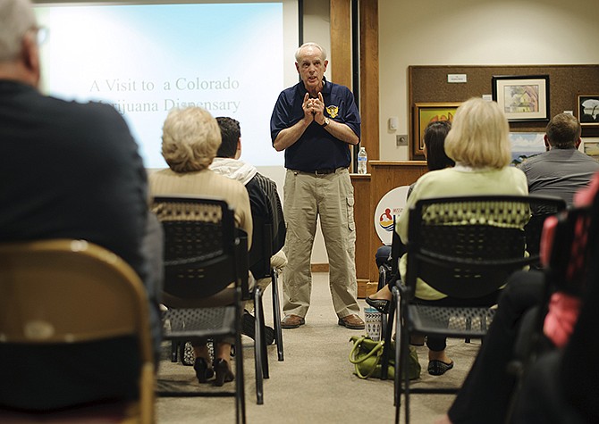 Guest speaker Ed Moses, a retired Missouri Highway Patrol drug recognition expert and former undercover narcotics officer, explains how marijuana potency has increased over the years Wednesday during Jefferson City Council for Drug Free Youth's "Weed Out the Myths" presentation at the Missouri River Regional Library. 
