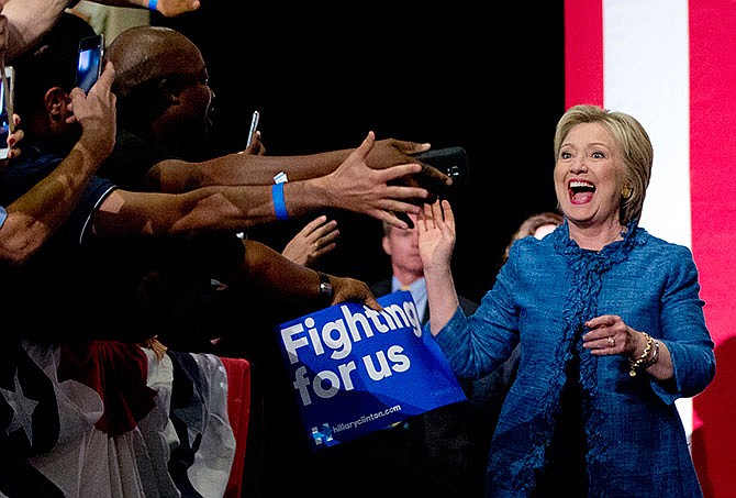 Democratic presidential candidate Hillary Clinton arrives to a cheering crowd as she arrives at an election night event at the Palm Beach County Convention Center in West Palm Beach, Fla., Tuesday, March 15, 2016.