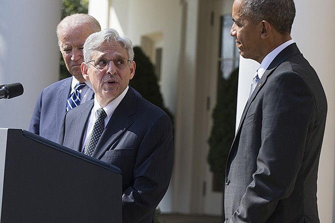 Federal appeals court judge Merrick Garland, center, speaks as President Barack Obama and Vice President Joe Biden look on after he was introduced as Obama's nominee for the Supreme Court during an announcement Wednesday in the Rose Garden of the White House.