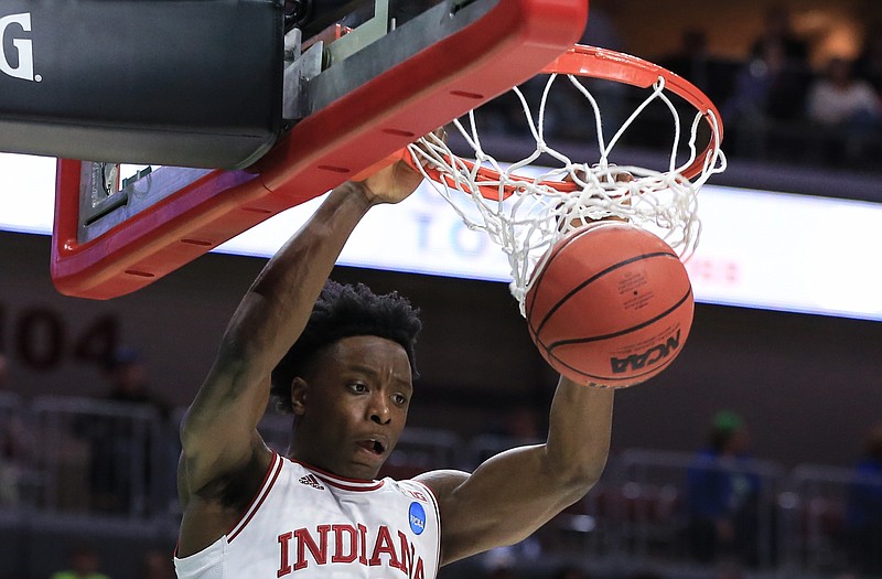 OG Anunoby of Indiana dunks over Chattanooga's Eric Robertson during Thursday night's first-round game in the NCAA Tournament in Des Moines, Iowa. Anunoby, the former Jefferson City Jay, finished 6-of-7 from the field for a career-high 14 points for the Hoosiers in their 99-74 win. Anunoby and Hoosiers will play in the second round Saturday.