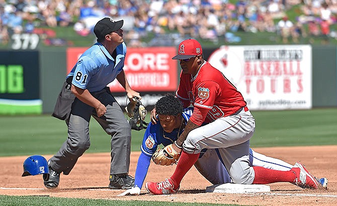 Angels manager Mike Scioscia: Rangers threw at Andrelton Simmons' neck