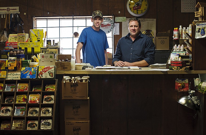 Payway Feed Store owner and operator Brian Meller, right, stands alongside his son, Alex, who has spent the last few years carrying on the family tradition working with his dad at the Jefferson Street feed store started by his grandfather Henry Meller in 1959.
