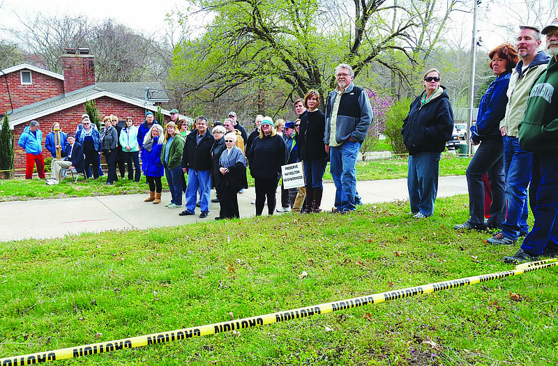 Residents around Hayselton Drive fill the 50-foot width of the right-of-way that would be needed for an access drive  to a proposed subdivision. The neighborhood is fighting the development, arguing in part that the drive is located on a hairpin curve, which would be dangerous. The Jefferson City Council will hold a public hearing on the development at 6 p.m. April 4.