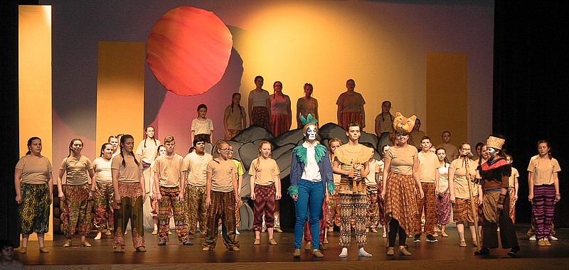 Front, from left, Zazu (Makayla Schanzmeyer), King Mufasa (Dawson Gump) and Queen Sarabi (Hailey Schepers) show the newborn cub to Pridelands with the animals in attendance.