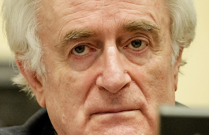 Bosnian Serb wartime leader Radovan Karadzic is seen in the courtroom Thursday March 24, 2016, for the reading of his verdict at the International Criminal Tribunal for Former Yugoslavia in The Hague, The Netherlands. The former Bosnian-Serbs leader is indicted for genocide, crimes against humanity, and war crimes.