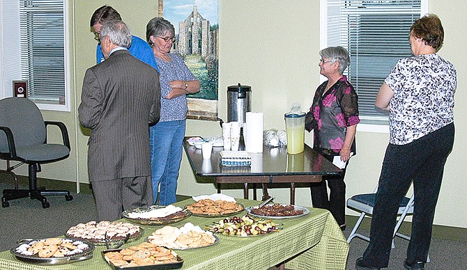 At the open house, library patrons check out Heyssel Hall on the second floor of the library, while enjoying cookies, tea and coffee.