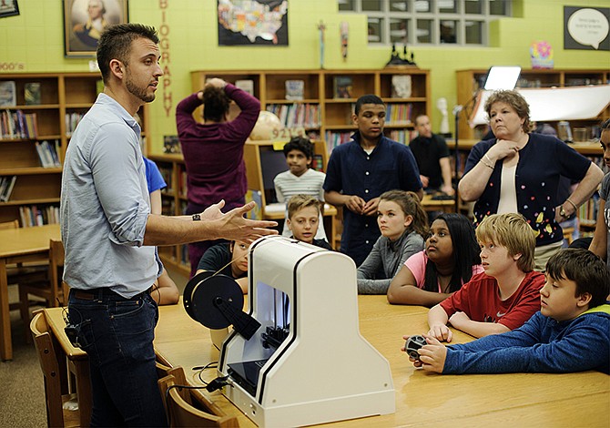 ROBO 3D co-founder and CEO Braydon Moreno answers questions after presenting one of his company's 3-D printers to the Jefferson City Boys and Girls Club Monday afternoon in the Thomas Jefferson Middle School library. The 3-D printer was possible thanks to a 2014 grant from the Department of Elementary and Secondary Education for a science, technology, engineer and math program. 