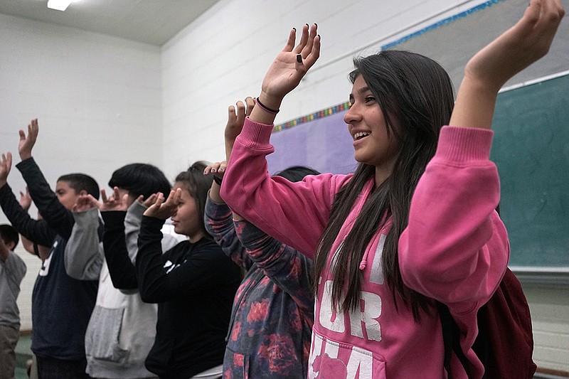 Student Maleenah Vera waves her arms during music class Tuesday at Stevenson Middle School in East Los Angeles. Los Angeles Unified School District, the nation's second largest, once had a $76.8 million budget for arts education, but years of cuts and layoffs wiped all art classes from dozens of schools - leaving many students in the entertainment capital of the world with no music, visual arts, dance or theater instruction.