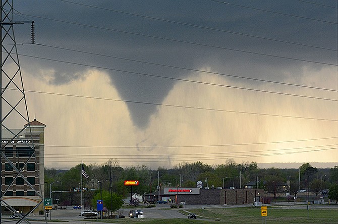 A tornado touches down Wednesday in Tulsa, Oklahoma. The National Weather Service confirmed multiple tornado touchdowns in the Tulsa area.