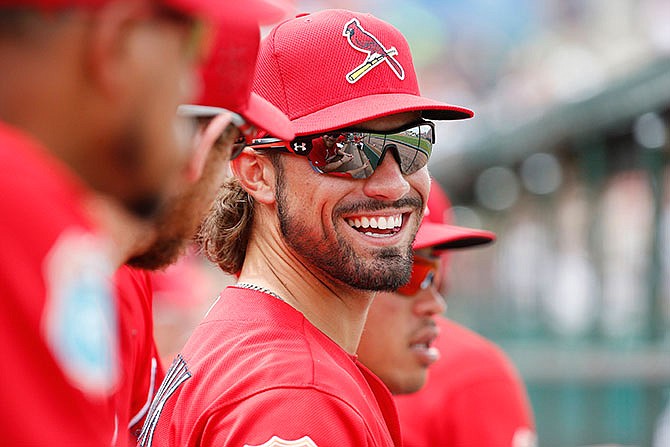 St. Louis Cardinals' Randal Grichuk laughs with teammates in the dugout during the sixth inning of an exhibition spring training baseball game against the Miami Marlins, Sunday, March 20, 2016, in Jupiter, Fla.