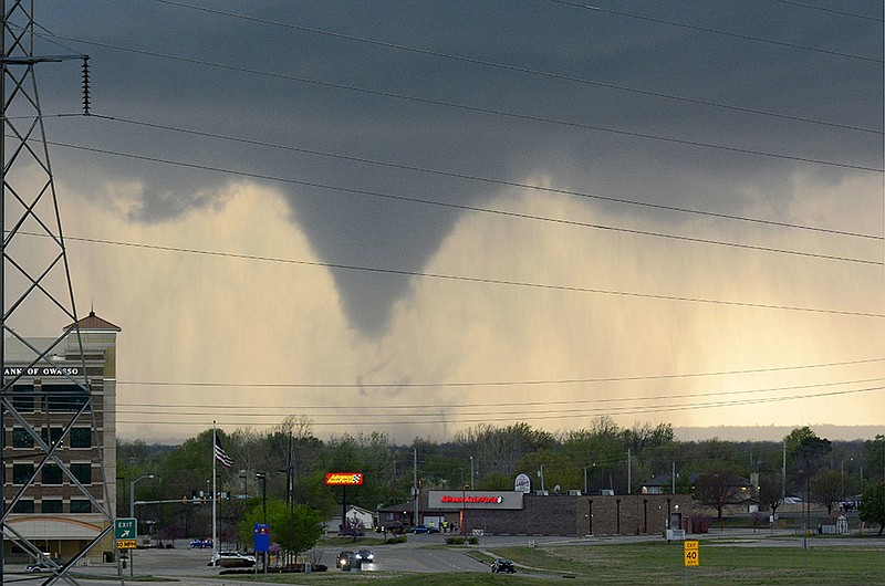 A tornado touches down in Tulsa, Okla., on Wednesday, March 30, 2016. The National Weather Service is confirming multiple tornado touchdowns in the Tulsa area. 