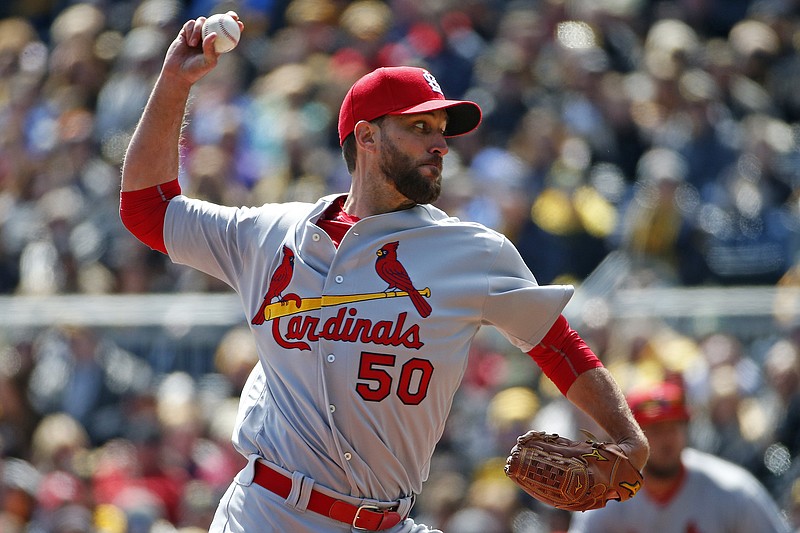 Cardinals starting pitcher Adam Wainwright works to the plate during Sunday afternoon's game against the Pirates in Pittsburgh.