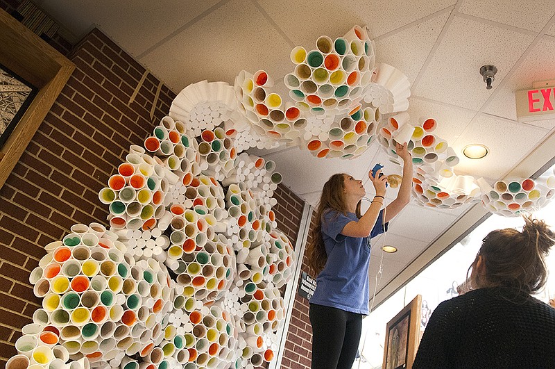 Student Hannah Haltom works on an art installation Friday, Apr. 1, 2016 titled "Microscopic Organisms" in the foyer at Pleasant Grove High School. Students spent the day setting up for the 18th annual Juried Arts Exhibition & AP Senior Exhibit at PGHS. 

