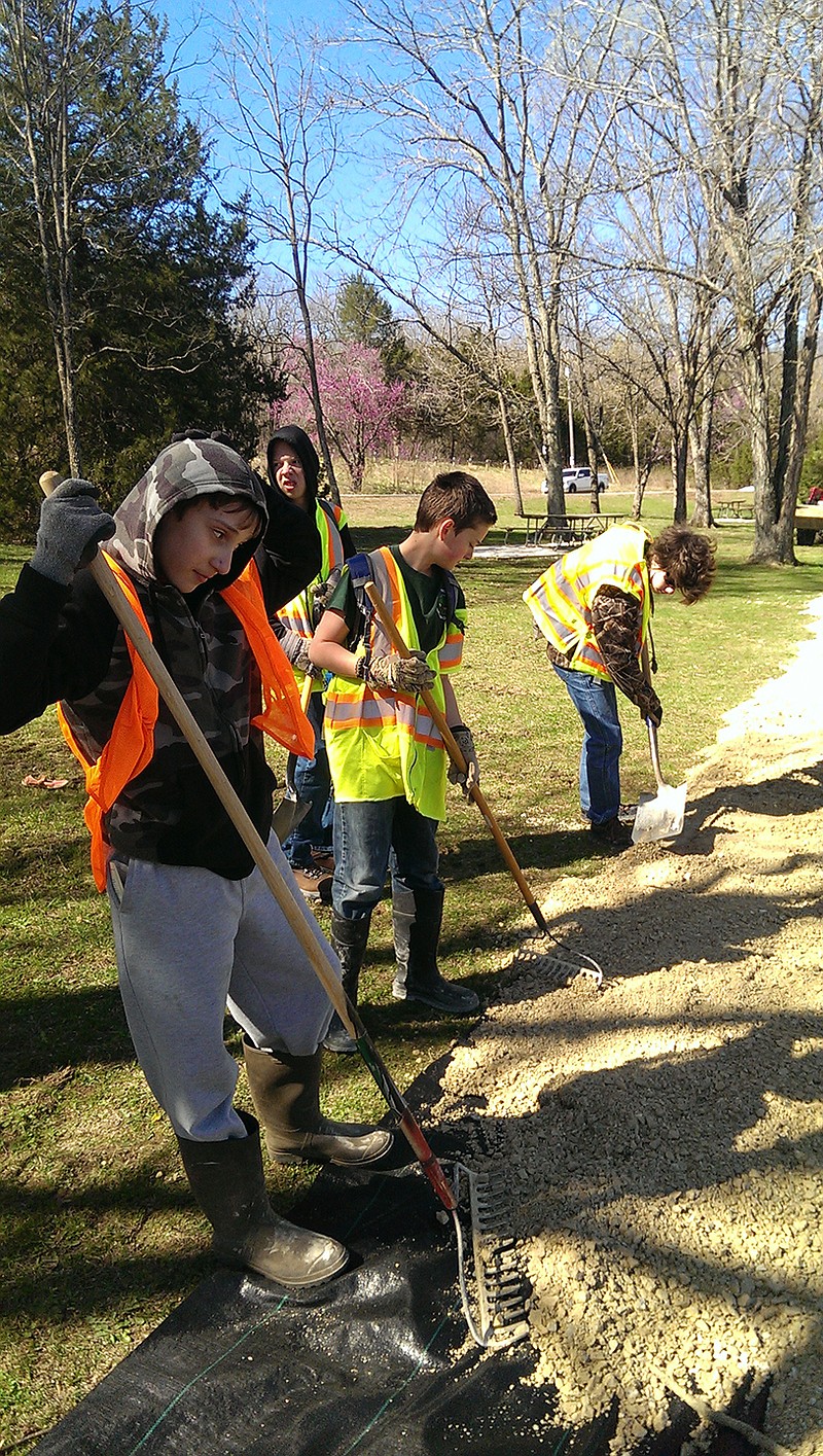 Jefferson City Scouts work to build a trail Saturday at Ha Ha Tonka State Park.