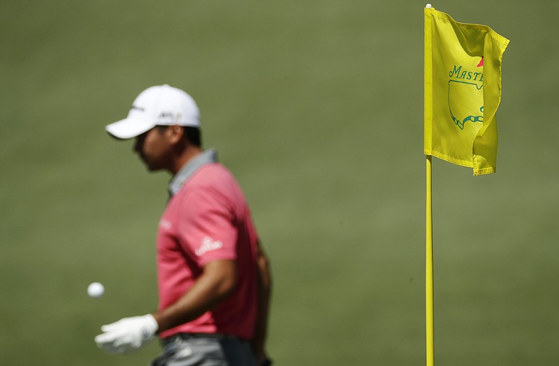 Jason Day walks off the green after putting on the second hole during a practice round for the Masters tournament Tuesday in Augusta, Ga. 