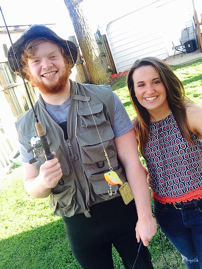 Pictured are Charles Nelson and Sydney Vogel, both Jefferson City High School seniors. Using a hammer and letter press, Nelson stamped out "Will you be my catch to prom?" They have been friends since fifth grade and described the prom as their "last hurrah" before going their separate ways to colleges.