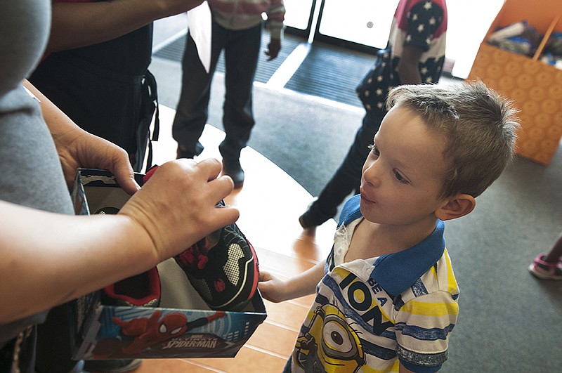Keegan Fant reacts to seeing his new Spider-Man shoes during the annual Junior League of Texarkana Shoes for the Soul and Clothes for a Cause on Saturday, Apr. 9, 2016 at Payless Shoes and Target in Texarkana, Texas. This year marked the first year the Junior League of Texarkana partnered with Target to provide children with new clothes as well as shoes. 