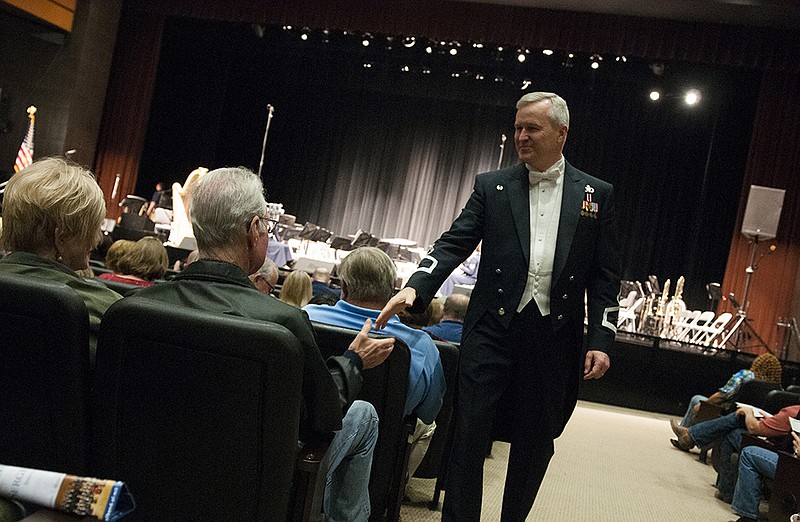 Col. Larry H. Lang, commander and conductor of the United States Air Force Band, shakes hands with members of the audience Sunday, Apr. 10, 2016 before the beginning of the United States Air Force Concert Band and Singing Sergeants performance at the Sullivan Performing Arts Center. 