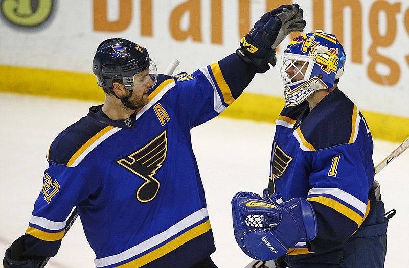 Blues goalie Brian Elliott congratulated by Alex Pietrangelo after a 5-2 win against the Coyotes earlier this month in St. Louis.