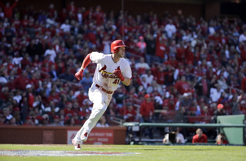 Jeremy Hazelbaker of the Cardinals heads down the first-base line after hitting a sacrifice fly to score Matt Carpenter during the second inning of Monday's game with the Brewers in St. Louis.