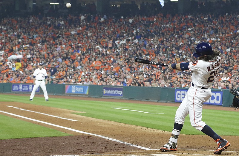 The Astros' Colby Rasmus belts a two-run home run during the first inning of Monday's game with the Royals in Houston.