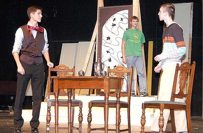 With scenery under construction, students Mason Albertson (John Worthington), right; Jack Johnston (Algernon Moncrieff); and Matthew Henley (Lane, the butler), back center, practice for their roles in the California High School Drama Club presentation of â€œThe Importance of Being Earnest.â€ The play is to be performed at 7:30 p.m. April 16 and 2 p.m. April 17.