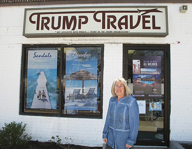 Claudia Rabin-Manning stands outside her Baldwin, New York, business, Trump Travel on April 6. Rabin-Manning said she has been the target of legal action from Republican presidential candidate Donald Trump over the use of the name Trump Travel. She explains the business name has nothing to do with the businessman, and instead was named by a previous owner of the travel agency.