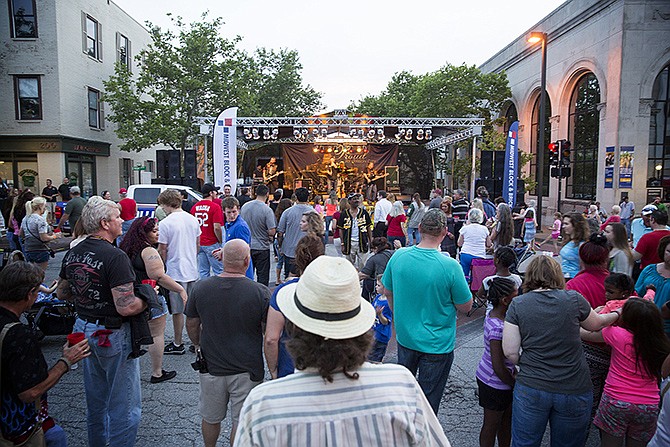 In this June 4, 2015, file photo, fans crowd the stage at the corner of High and Madison streets in downtown Jefferson City to hear the biker-rock music of American Hitmen during a Thursday Night Live event.