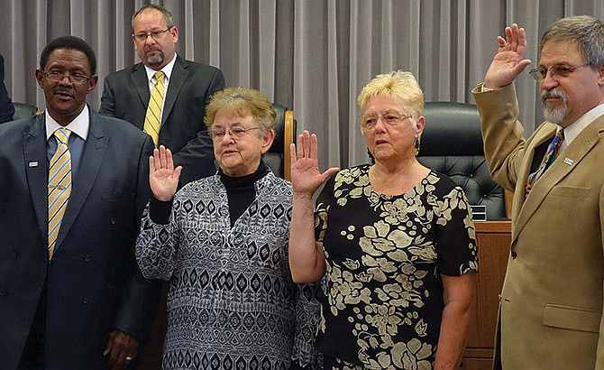 From left, 4th Ward Councilman Steve Moore, 3rd Ward Councilwoman Beverly Gray, 2nd Ward Councilwoman
Mary Rehklau and 1st Ward Councilman Mike West are sworn in.