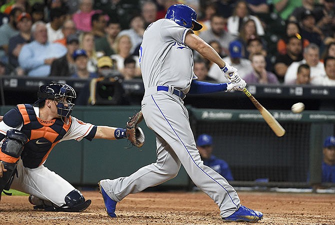 Kansas City Royals' Eric Hosmer hits a two-run double in the sixth inning of a baseball game against the Houston Astros, Thursday, April 14, 2016, in Houston.