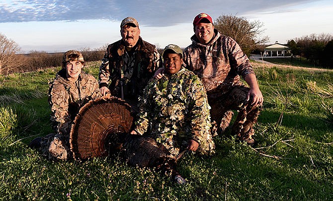 Chris Brown was a successful participant in Missouri Gov. Jay Nixonâ€™s 8th Annual Youth Turkey Hunt. Pictured from left are Brenden Sneed, Rudi Roeslein, Brown and Brandon Butler. 