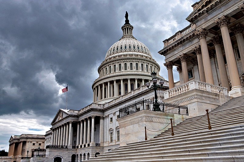 This photo taken July 23, 2013, shows the U.S. Capitol in Washington. Congress returns to work this week with a relatively short and simple agenda, vote to keep the government operating in the short term, then return home to campaign. National security threats from Islamic State militants and Russian aggression in Ukraine loom large, but September's session may be too short for lawmakers to do anything but talk about them.  