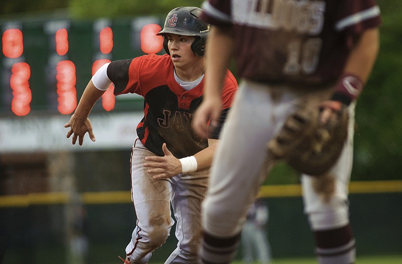 Grant Wood of Jefferson City hustles back to first base to avoid a pickoff attempt by the Rolla catcher during the Jaysâ€™ game Wednesday night at Vivion Field.