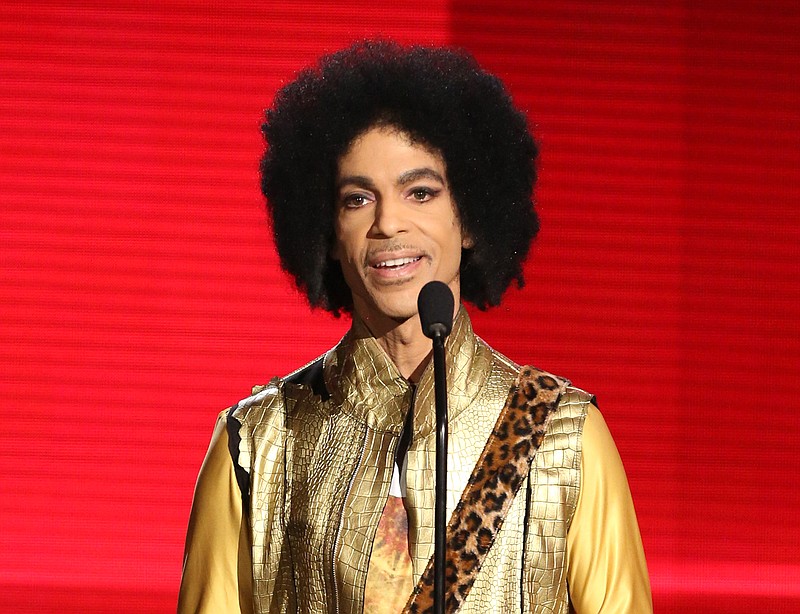 In this Nov. 22, 2015 file photo, Prince presents the award for favorite album - soul/R&B at the American Music Awards in Los Angeles. Authorities are investigating a death at Paisley Park, where pop superstar Prince has his recording studios. Jason Kamerud, Carver County chief sheriff's deputy, tells the Minneapolis Star Tribune that the investigation began on Thursday morning, April 21, 2016.