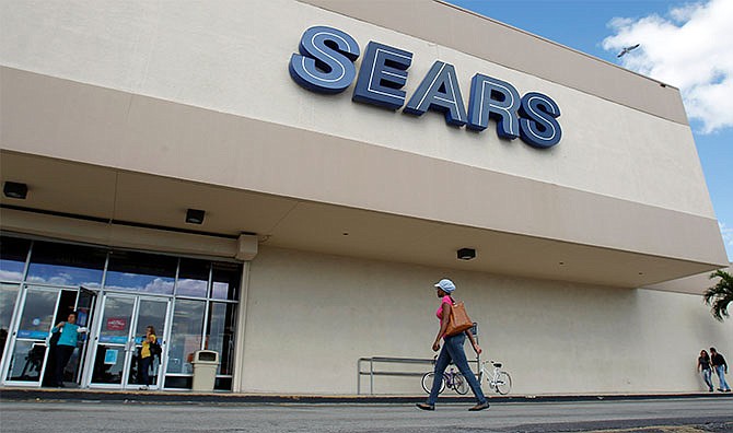 In this Nov. 9, 2012, photo, a Sears store is shown in Hialeah, Fla. Sears Holdings Corp. announced Thursday, April 21, 2016, that it will close 68 Kmart stores and 10 Sears stores as it struggles to restore profitability.