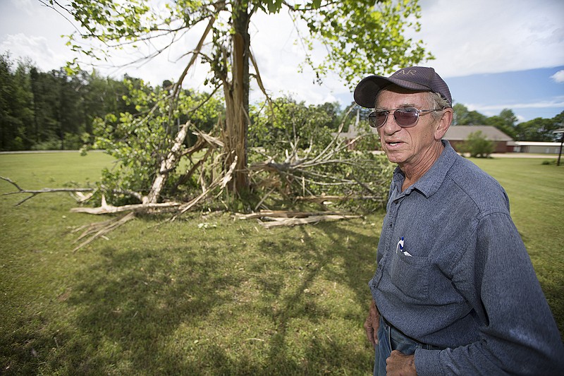 Ray Aston of Ashdown Ark., talks Thursday, April 21, 2016 about the tulip poplar tree in his front yard that was recently shattered by lightning. The 30-foot tree had been the focal point of the Astons' front yard for over 20 years. 
