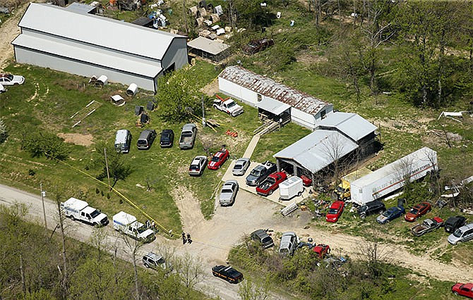 This aerial photo shows one of the locations being investigated in Pike County, Ohio, as part of an ongoing homicide investigation, Friday, April 22, 2016. Several people were found dead Friday at multiple crime scenes in rural Ohio, and at least most of them were shot to death, authorities said. (Lisa Marie Miller/The Columbus Dispatch via AP) 