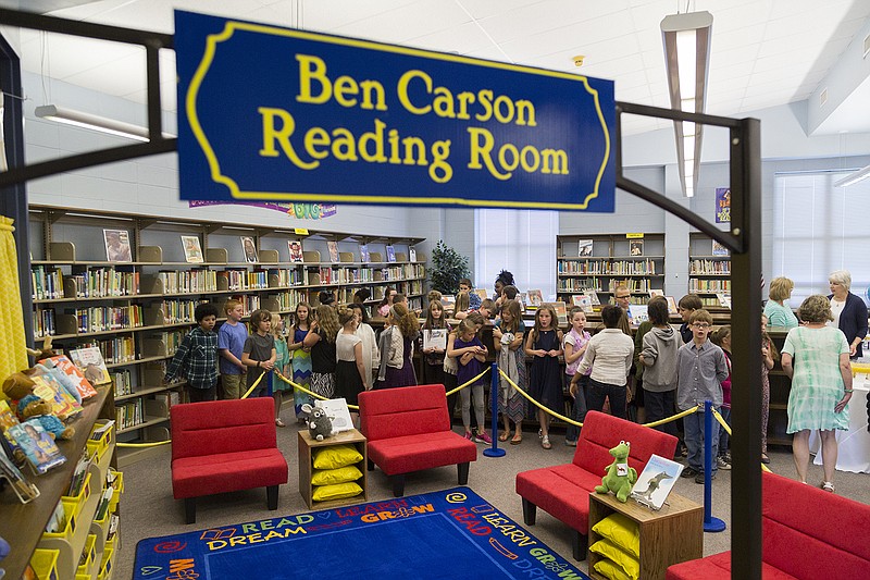 L.F. Henderson Intermediate School students stand Friday, April 22, 2016 outside the new Ben Carson Reading Room in the media center at the school in Ashdown, Ark. Domtar and its suppliers partnered with the Carson Scholars Fund, founded by retired pediatric neurosurgeon and former presidential candidate Ben Carson, to supply books and a comfortable space to read. Use of the space will be an incentive for good grades and behavior. The media center will still be used as a library and classroom for 28 students, in addition to housing the Reading Room.