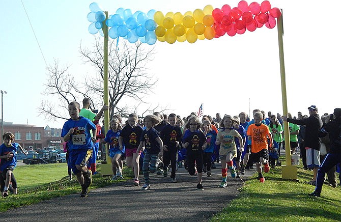 The second-annual Super Hero 5K & 1 Mile Fun Run at Fulton's Memorial Park Saturday morning involved more than 200 participants to raise money for pediatric cancer research.